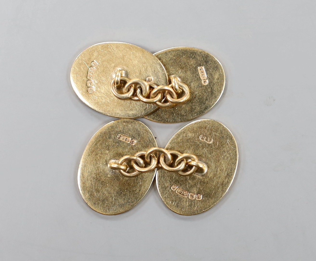 A pair of 9ct gold oval disc cufflinks, 19mm, 10.1 grams